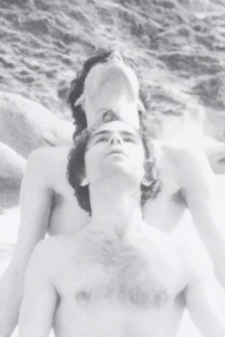 A cinematic exploration that captures two bodies moving through space and time—at times mobile, at times still, intertwined, broken, tense, restrained—suspended between heaven and earth, sand and rock. Their sudden pause crystallizes the moment, fixing its eternity.