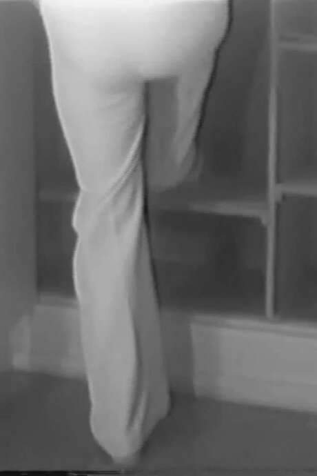Letícia Parente, a pioneering Brazilian video artist, created In as one of her earliest works. The piece shows her entering a closet, suspending herself from a coat hanger and closing the door. Parente used video to protest the military dictatorship and its mass torture, turning domestic spaces and everyday household tasks into symbols of resistance against imposed gender roles.