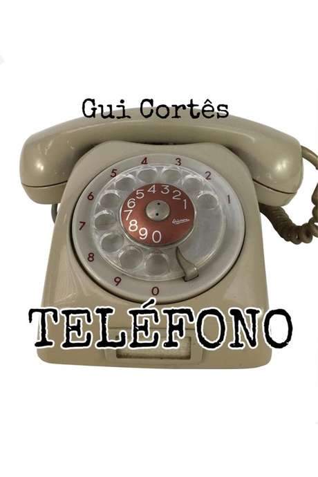 A man makes a call in an old phone.